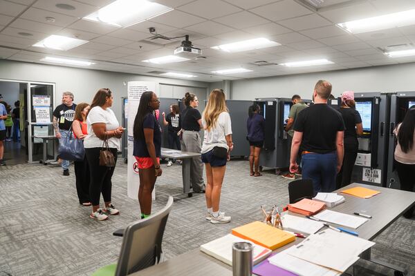 People wait in line to vote at the Buckhead Library on election day on Tuesday, May 19, 2026, in Atlanta. (Abbey Cutrer/AJC)