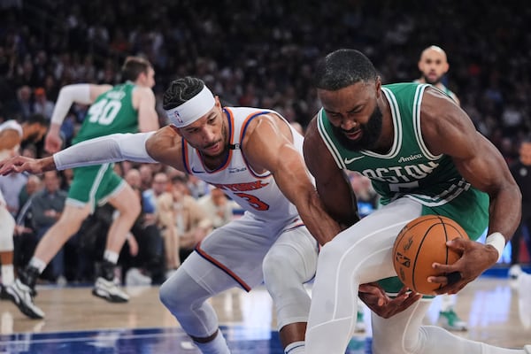 Boston Celtics' Jaylen Brown (7) fights for control of the ball with New York Knicks' Josh Hart (3) during the first half of Game 6 in the Eastern Conference semifinals of the NBA basketball playoffs Friday, May 16, 2025, in New York. (AP Photo/Frank Franklin II)