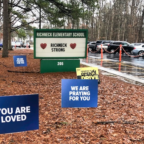 FILE - Signs stand outside Richneck Elementary School in Newport News, Va., Jan. 25, 2023. (AP Photo/Denise Lavoie, File)