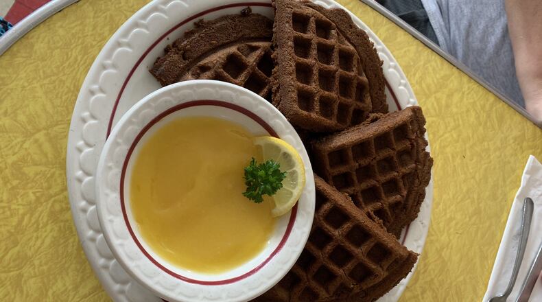 At Java Jive on Ponce de Leon Avenue in Atlanta, gingerbread waffles served with lemon curd on the side are a weekend brunch exclusive. CONTRIBUTED BY OLIVIA KING