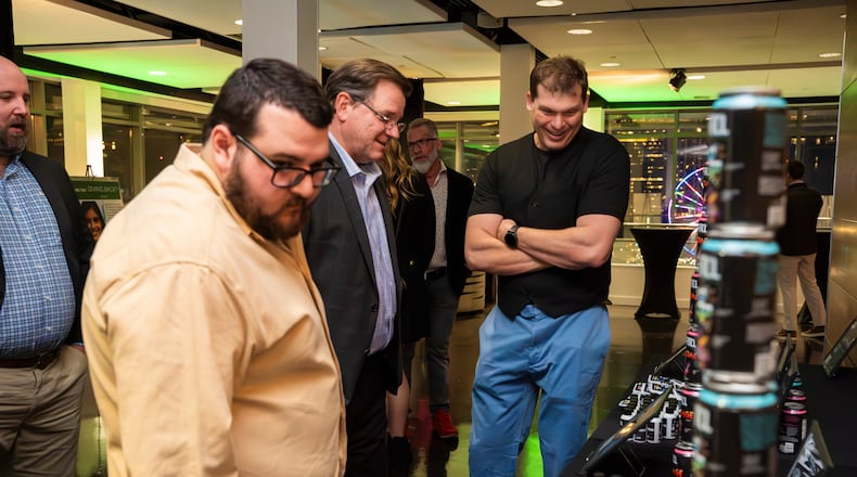 Allen Porter's engages with guests indulge at his extravagant unveiling party for his patented, legal cannabis-infused drink at Ventanas rooftop, Atlanta, GA, on March 9, 2024. (Olivia Bowdoin for the AJC).