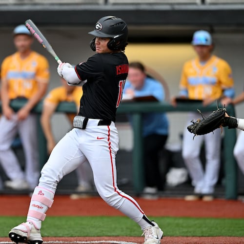 Georgia Kenny Ishikawa (14) hits a single, but advances to third base on a throwing error during the third inning of their NCAA Regional game at Foley Field, Friday, May 29, 2026, in Athens. (Hyosub Shin/AJC)