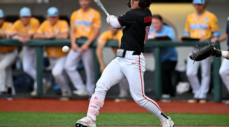 Georgia Kenny Ishikawa (14) hits a single, but advances to third base on a throwing error during the third inning of their NCAA Regional game at Foley Field, Friday, May 29, 2026, in Athens. (Hyosub Shin/AJC)