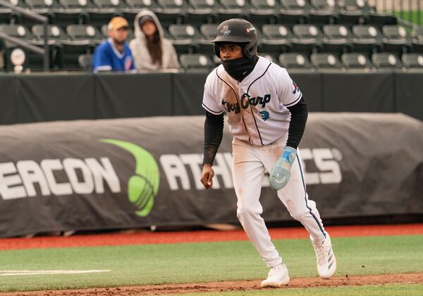 In this undated image provided by the Beloit Sky Carp, Sky Carp's Emaarion Boyd takes a lead off base during a minor league baseball game. (Ty McElroy/Beloit Sky Carp via AP)