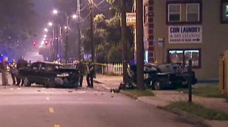 Police investigate the scene of an incident on McDaniel Street in Atlanta that involved multiple gunshots, a head-on collision, one person dead and at least six injured.