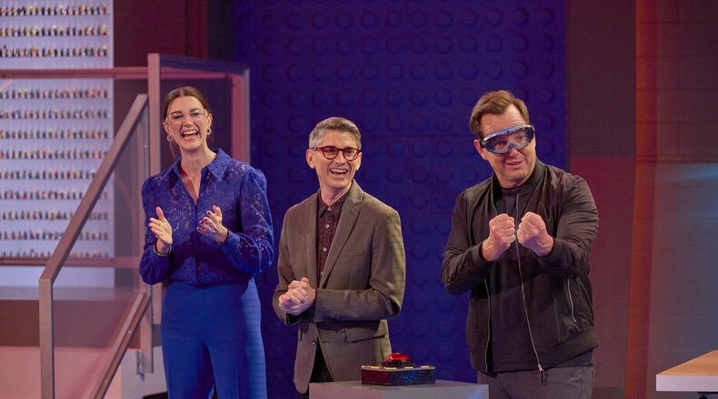 Judges Amy Corbett (from left), Jamie Berard and host Will Arnett in the “Volcanic Brick-Ruption” episode of LEGO MASTERS airing Thursday, Oct.12 (9:02-10:00 PM ET/PT) on FOX. ©2023 FOX MEDIA LLC. CR: Tom Griscom/FOX