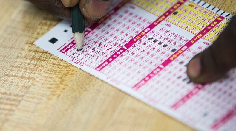 The Powerball lottery will be the hot ticket on Saturday as the jackpot rolls to $535 million. (Photo by Samuel Corum/Anadolu Agency/Getty Images)