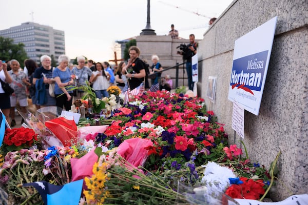 People attend a candlelight vigil for former House Speaker Melissa Hortman and her husband Mark, who were fatally shot, at the state Capitol, Wednesday, June 18, 2025, in St. Paul, Minn. (AP Photo/Nikolas Liepins)