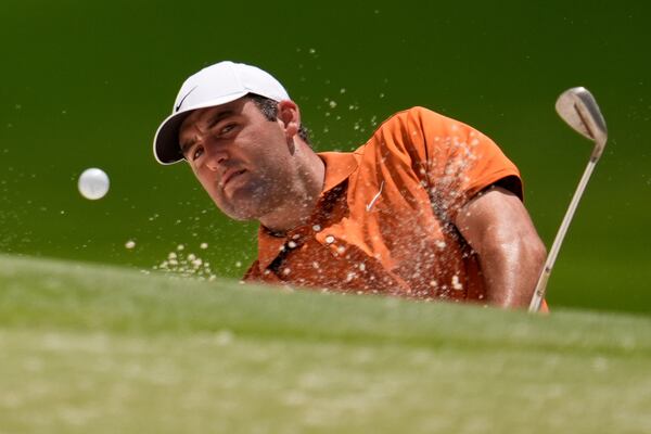 Scottie Scheffler hits from the bunker on the 15th hole during a practice round for the PGA Championship golf tournament at the Quail Hollow Club, Wednesday, May 14, 2025, in Charlotte, N.C. (AP Photo/George Walker IV)