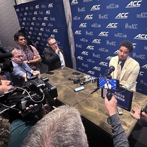 Miami quarterback Darian Mensah listens during ACC Kickoff preseason football media days, Wednesday, July 15, 2026 in Charlotte, N.C. (AP Photo/Aaron Beard)