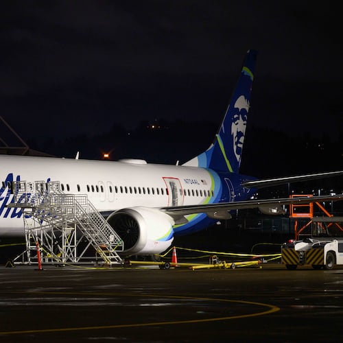 A plastic sheet covers an area of the fuselage of the Alaska Airlines N704AL Boeing 737 MAX 9 aircraft outside a hangar at Portland International Airport on Jan. 8, 2024, in Portland, Oregon, following a midair fuselage blowout on Jan. 5. None of the 171 passengers and six crew members were seriously injured. (Mathieu Lewis-Rolland/Getty Images/TNS)