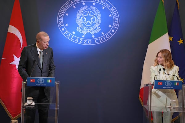 Turkish President Recep Tayyip Erdogan, left, and Italian Premier Giorgia Meloni meet the media during a joint press conference at Villa Pamphilj in Rome, Tuesday, April 29, 2025. (AP Photo/Francisco Seco)