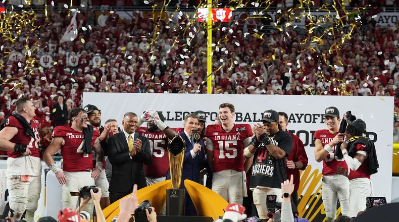 FILE - Indiana quarterback Fernando Mendoza (15) is interviewed during the trophy ceremony after Indiana defeated Miami in a College Football Playoff national championship game, Jan. 19, 2026, in Miami Gardens, Fla. (AP Photo/Lynne Sladky, File)
