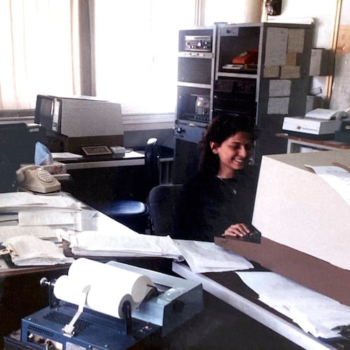 This handout photo provided by Hasan Mroue, shows Mona Ziade, right, and newsman Hasan Mroue work at the AP Middle East head office in Nicosia, Cyprus in the late 1980s. (Hasan Mroue via AP)