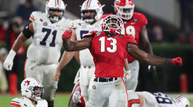 Georgia linebacker Azeez Ojulari reacts to sacking Auburn quarterback Bo Nix Saturday, Oct 3, 2020, in Athens. (Curtis Compton / Curtis.Compton@ajc.com)