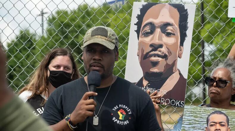 Gerald Griggs, seen in 2021 speaking to people gathered on the anniversary of the killing of Rayshard Brooks, says the NAACP will continue working to get a prosecutor to present a criminal case to a grand jury. (Photo Courtesy of Megan Varner/Getty Images)