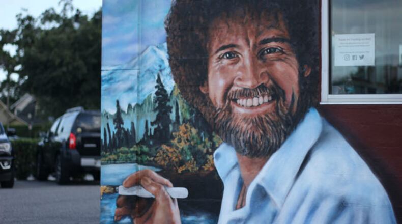Muralist Jonas Never painted a mural of Central Florida native Bob Ross on the side of the Floyd's 99 Barbershop on Fairbanks Avenue in Winter Park this March. (Photo: WFTV.com)