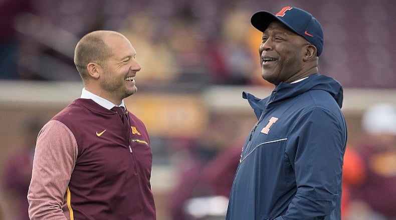 Minnesota head coach P.J. Fleck, left, and Illinois head coach Lovie Smith chat on the field before the start of play at TCF Bank Stadium in Minneapolis on October 21, 2017. (Elizabeth Flores/Minneapolis Star Tribune/TNS)