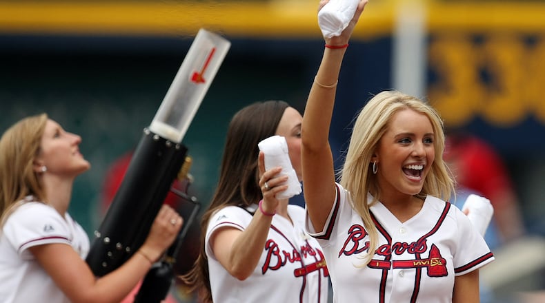 Do you have the right stuff to operate the T-shirt gun? Members of Atlanta Braves’ Tomahawk Team pass out free t-shirts to fans during a game at Turner Field in this file photo. With the Tomahawk Team imoving to SunTrust Field right along with the on-field squad, the Braves will host tryouts starting later this month. CURTIS COMPTON / ccompton@ajc.com