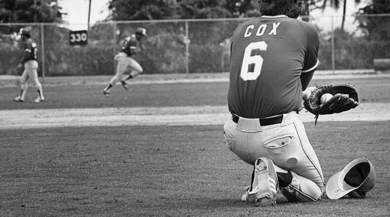 Braves manager Bobby Cox looks over his squad during spring training workout in 1980.