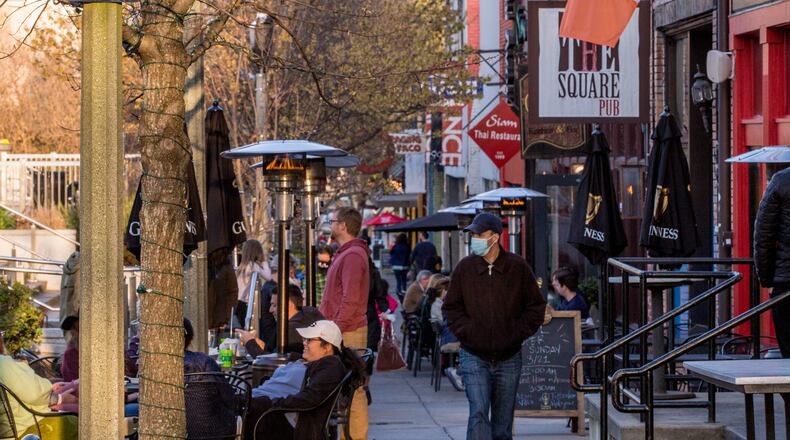 Decatur Square is busy on the first official day of Spring, Saturday, March 20, 2021 with families and outdoor diners enjoying the weather, live music and ice cream. (Jenni Girtman for The Atlanta Journal-Constitution)