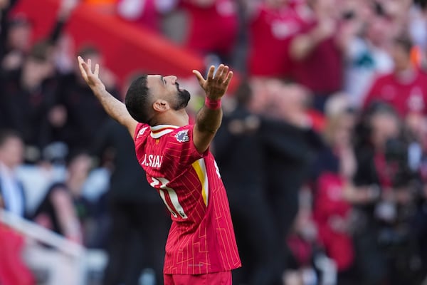 Liverpool's Mohamed Salah celebrates after winning the English Premier League soccer match between Liverpool and Tottenham Hotspur and clinching the Premier League title at Anfield in Liverpool, England, Sunday, April 27, 2025. (AP Photo/Jon Super)