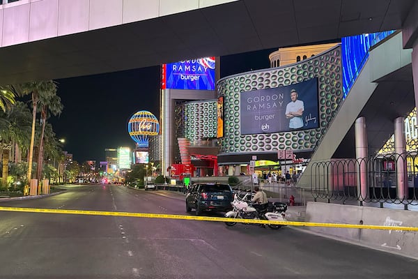 Las Vegas Metropolitan Police officers investigate the scene of a shooting on the Strip that left two dead Monday, June 9, 2025, in Las Vegas. (Madeline Carter/Las Vegas Review-Journal via AP)