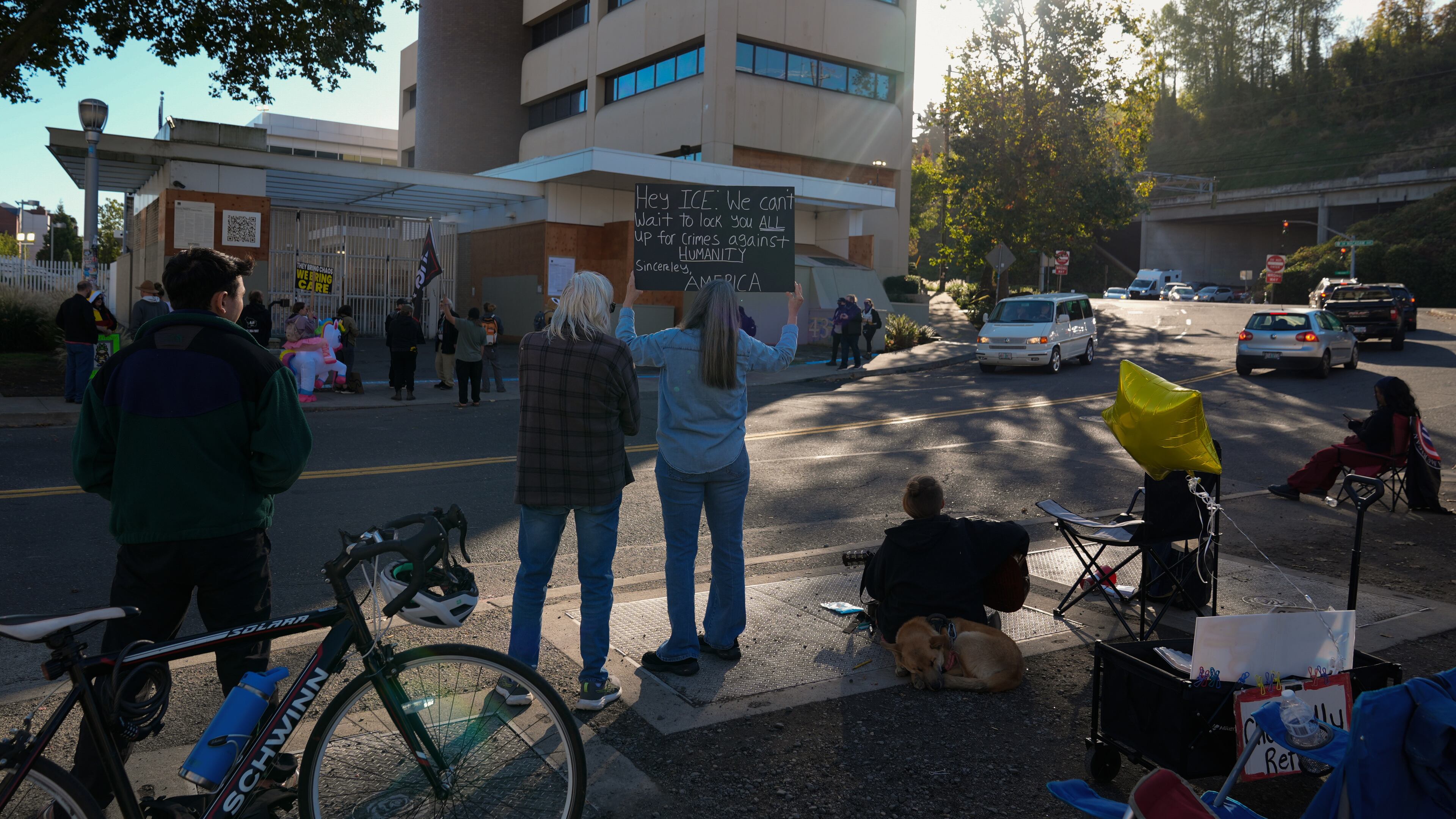 People protest outside a United States Immigration and Customs Enforcement (ICE) facility in Portland, Ore., Monday, Oct. 20, 2025. (AP Photo/Jenny Kane)
