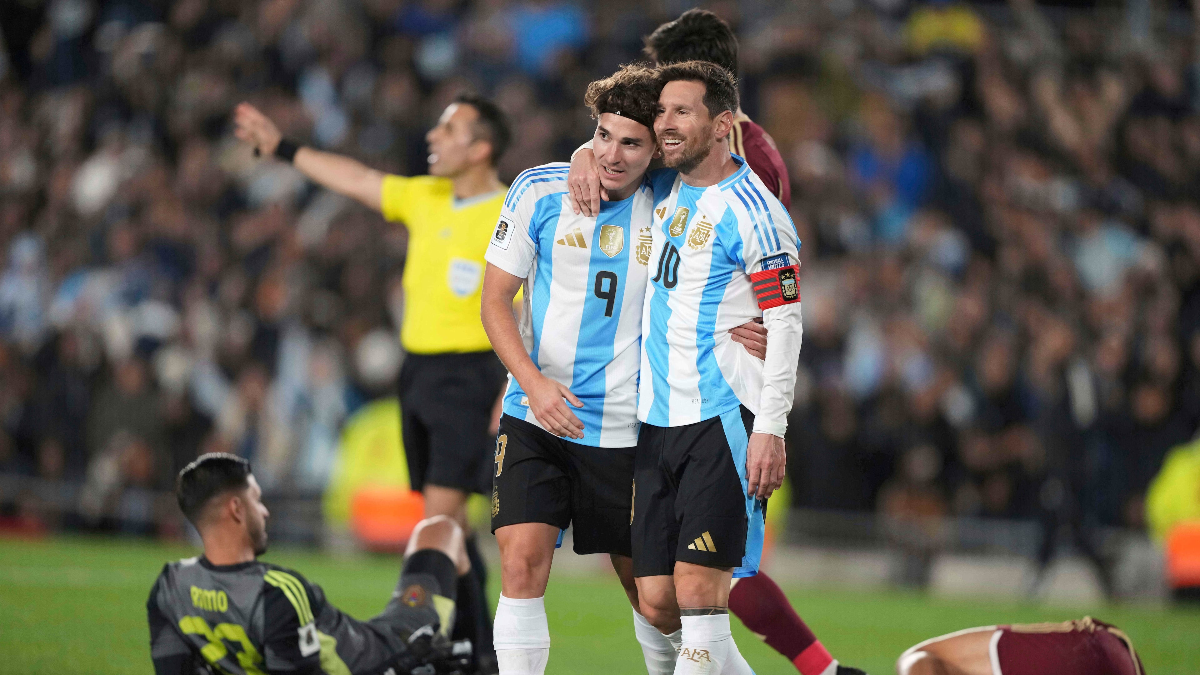 Argentina's Lionel Messi, right, celebrates with Julian Alvarez after scoring his side's opening goal against Venezuela during a World Cup 2026 qualifying soccer match at the Monumental stadium in Buenos Aires, Argentina, Thursday, Sept. 4, 2025. (Natacha Pisarenko/AP)