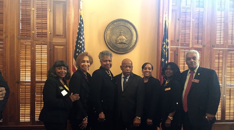 U.S. Rep. John Lewis, D-Atlanta, center, has his photo taken with members of the Georgia House on Wednesday. ERICA A. HERNANDEZ / ERICA.HERNANDEZ@AJC.COM