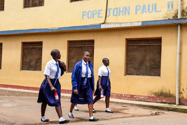Students walk around the school compound at Uganda Martyrs' Secondary School Namugongo, in Kampala, Uganda Monday, May 26, 2025. (AP Photo/Hajarah Nalwadda)