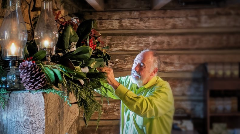 Mike Whittle of K Mike Whittle Designs, Inc. adorning the William Root House in Marietta with holiday decorations. Credit: Cobb Landmarks & Historical Society.