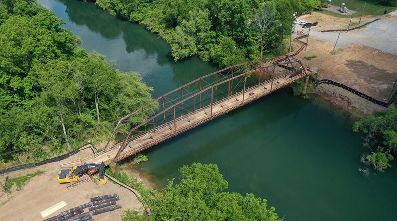 The Rogers Bridge replacement construction project continues over the Chattahoochee River in Johns Creek and Duluth. Most recently, the old water line was removed from the bridge structure. (Courtesy City of Johns Creek)
