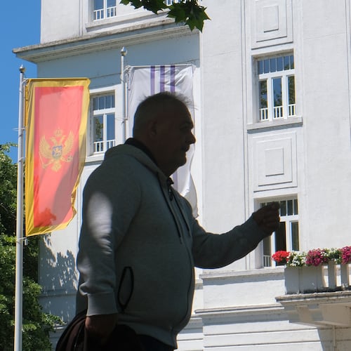 A man walks on a street in Montenegro's capital Podgorica, Monday, May 18, 2026. (AP Photo/Risto Bozovic)