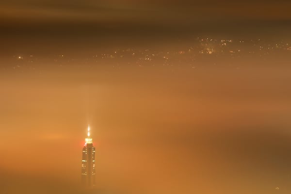FILE - The Avaz Twist Tower building rises above as smog covers Sarajevo, Bosnia, Dec. 19, 2023. (AP Photo/Armin Durgut, File)