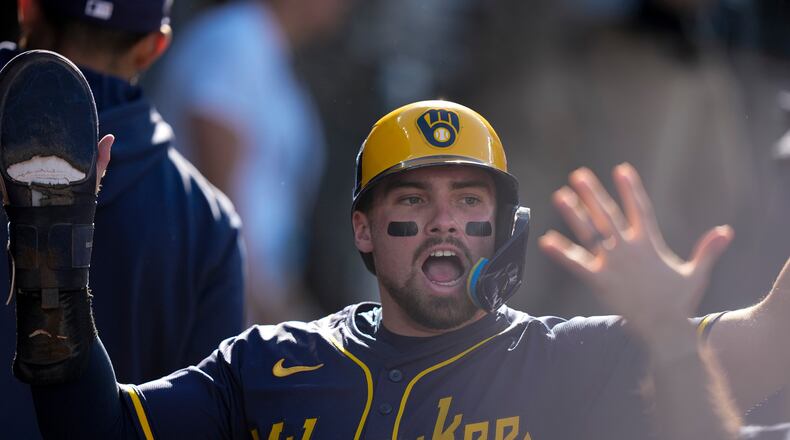 FILE - Milwaukee Brewers' Caleb Durbin celebrates after scoring against the Los Angeles Dodgers during the second inning in Game 3 of baseball's National League Championship Series, Oct. 16, 2025, in Los Angeles. (AP Photo/Brynn Anderson)