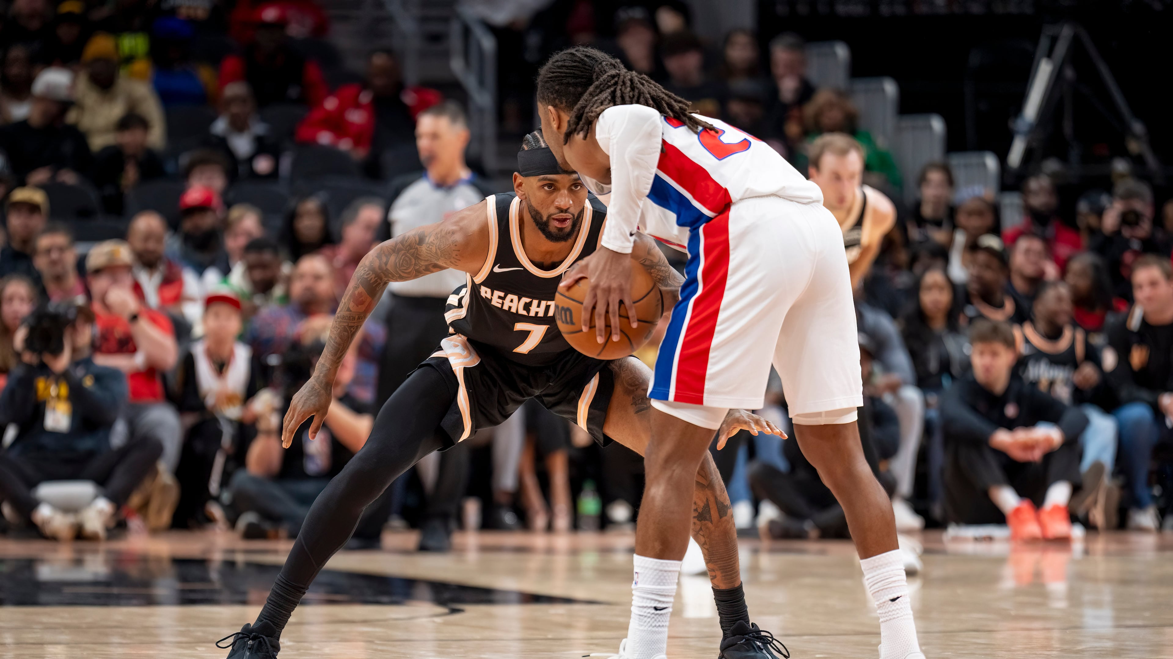 Atlanta Hawks guard Nickeil Alexander-Walker (7) defends the goal against Detroit Pistons guard Daniss Jenkins during the first half of an NBA basketball game, Tuesday, Nov. 18, 2025, in Atlanta. (Erik Rank/AP)