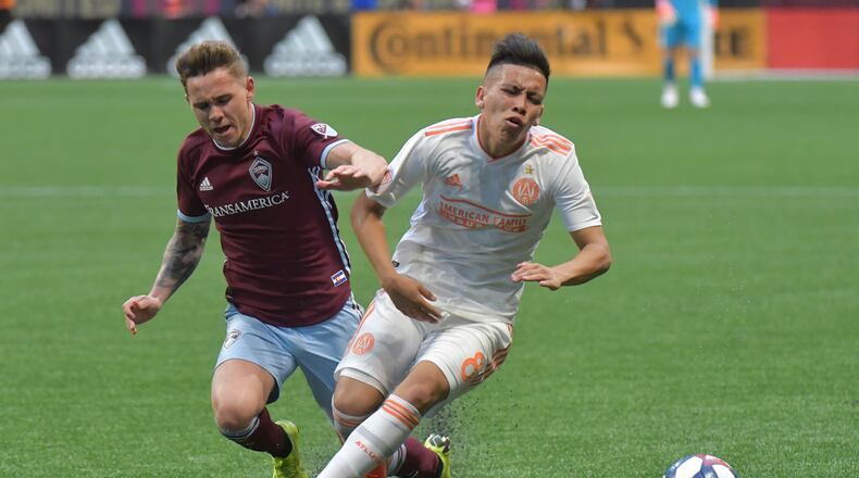 April 27, 2019 Atlanta - Atlanta United midfielder Ezequiel Barco (8) gets tackled by Colorado Rapids midfielder Sam Nicholson (28) during the second half in a MLS soccer match at Mercedes-Benz Stadium in Atlanta on Saturday, April 27, 2019. Atlanta United won 1-0 over the Colorado Rapids. HYOSUB SHIN / HSHIN@AJC.COM