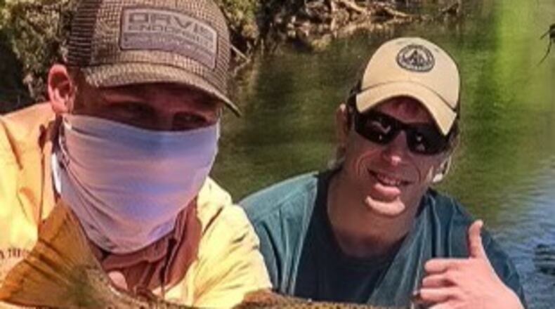 A guest on a full-day guided drift boat trip excursion caught his first Chattahoochee wild brown trout on a fly rod with RTA owner Chris Scalley. (L-R: Chris Scalley and Doc Small).