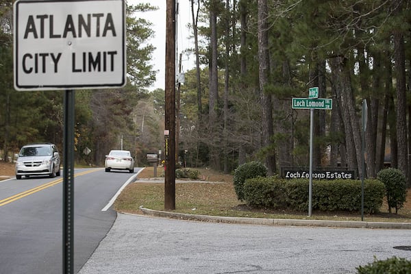 An Atlanta city limit sign is displayed near an entrance to the Loch Lomond Estates neighborhood in South Fulton. (ALYSSA POINTER/ALYSSA.POINTER@AJC.COM)