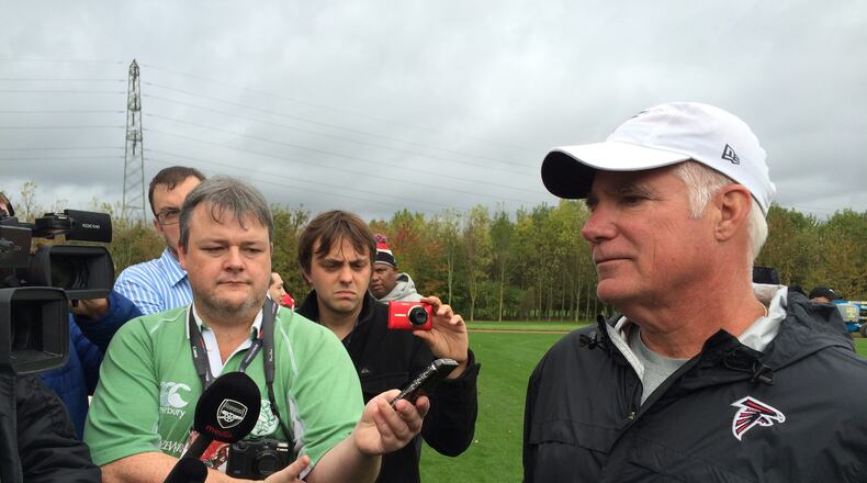 Falcon coach Mike Smith addressing the media after practice today. (Photo by D. Orlando Ledbetter/Dledbetter@ajc.com)