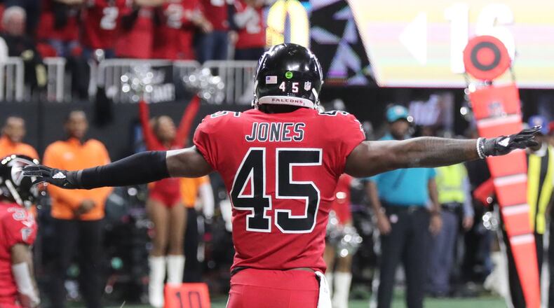 Atlanta Falcons middle linebacker Deion Jones (45) signals no catch after the Falcons held the Saints to a field goal on their first possession against the New Orleans Saints at Mercedes-Benz Stadium in Atlanta.