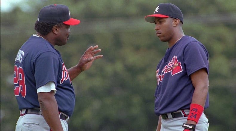 Batting coach Clarence Jones (left) talks with Braves outfielder Jermaine Dye during training camp in 1997. (File photo)