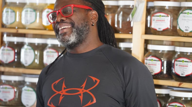 Chef Matthew Raiford explains the history of Gilliard Farms in the food lab he shares with his partner, herbalist Javon Sage. Wild-grown organic botanical-filled jars line the shelves. CONTRIBUTED BY SANJEEV AND UMA CHATTERJEE