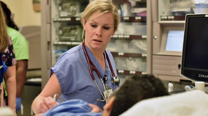 March 17, 2015 Little Rock, AR - Jennifer Hill, MD, performs ultrasound scan at the UAMS Emergency Department in Little Rock, Arkansas on Tuesday, March 17, 2015. When the Supreme Court ruled in 2012 that the federal government couldn't force states to expand Medicaid under Obamacare, Republican leaders across the country reveled in victory - staunchly refusing to grow the health program for poor Americans. But as Georgia and most of its conservative Southern-state brethren doubled down on their rejection of Medicaid expansion, a small group of Republican lawmakers in Arkansas saw opportunity. HYOSUB SHIN / HSHIN@AJC.COM