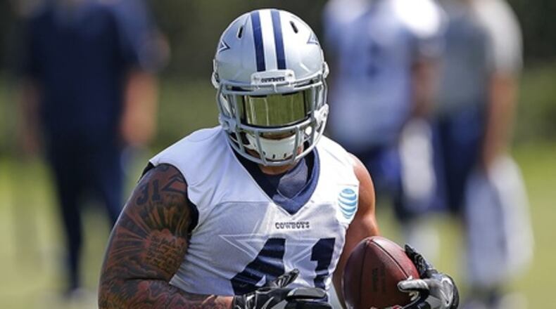 Fullback Keith Smith, a converted linebacker, was used to help paved the way with his lead-blocking for running back Ezekiel Elliott when he played for the Cowboys from 2014 to 2017. (Associated Press/James D. Smith)