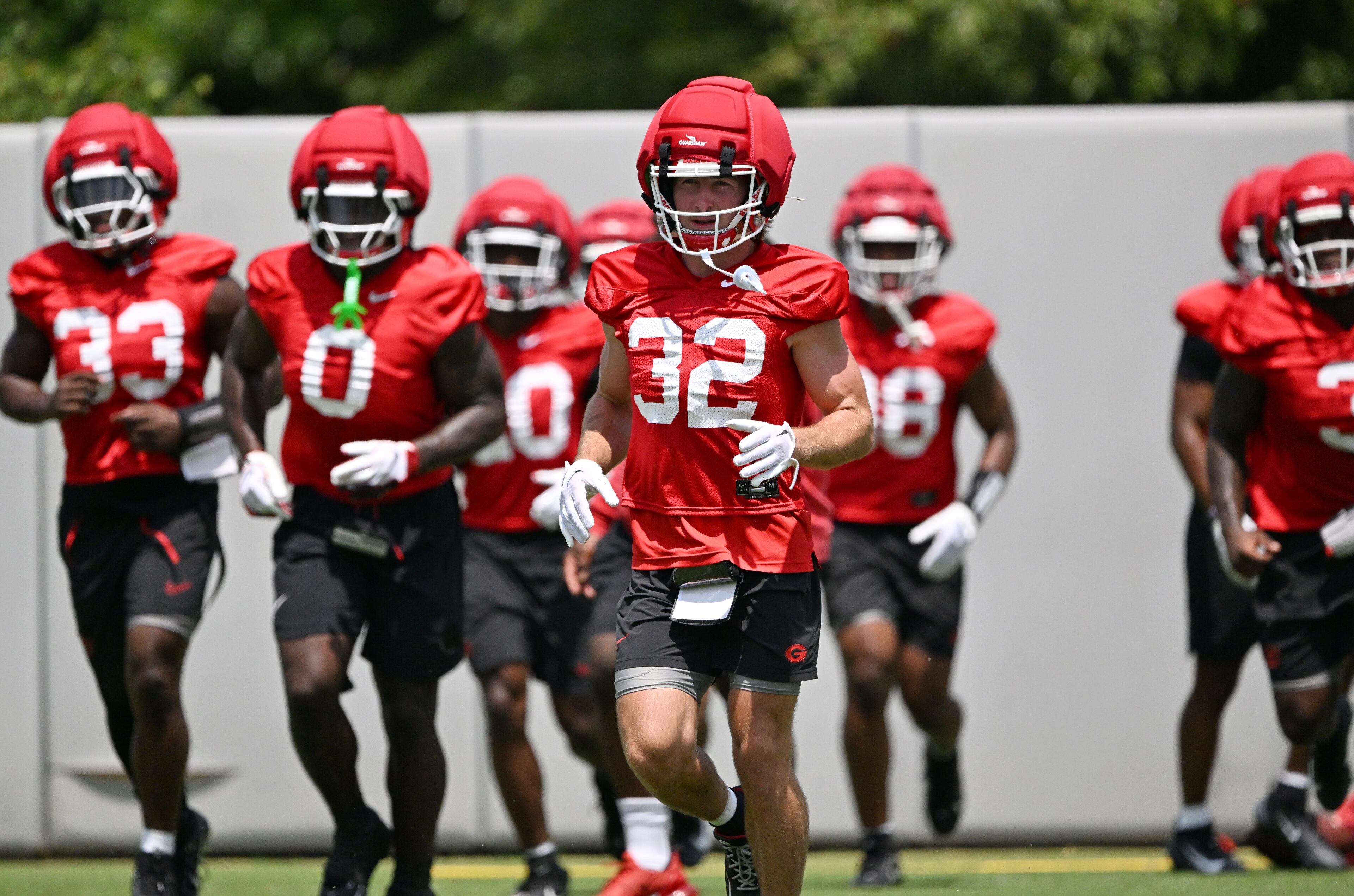 Georgia running back Cash Jones (32) and other players participate in a football practice at the University of Georgia practice facility, Thursday, July 31, 2025, in Athens. (Hyosub Shin / AJC)