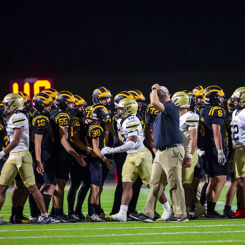 Sequoyah and Sprayberry players shake hands after the Chiefs defeated the Yellow Jackets 63-20 on Sept. 12, 2025, Sprayberry's lone loss of the season. Sequoyah won Class 5A Region 6 and hosts Coffee in the first round Friday, while Sprayberry hosts Lee County. (Oscar Guevara Saenz for the AJC)