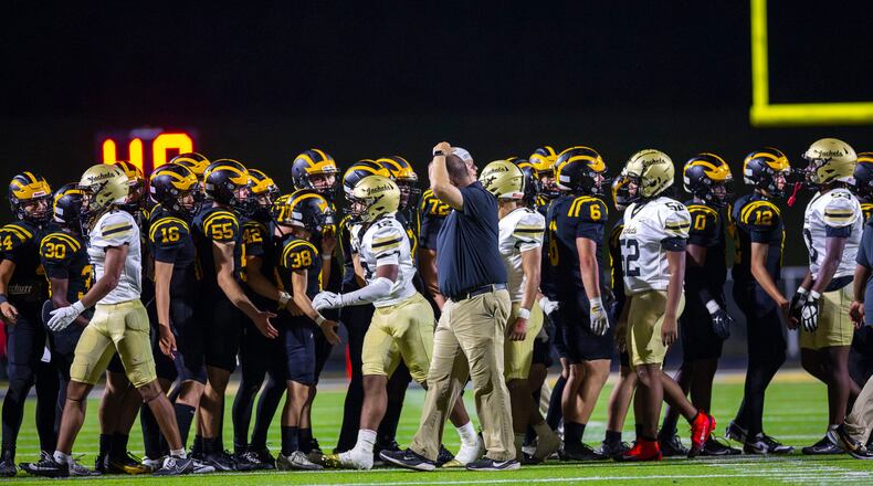 Sequoyah and Sprayberry players shake hands after the Chiefs defeated the Yellow Jackets 63-20 on Sept. 12, 2025, Sprayberry's lone loss of the season. Sequoyah won Class 5A Region 6 and hosts Coffee in the first round Friday, while Sprayberry hosts Lee County. (Oscar Guevara Saenz for the AJC)