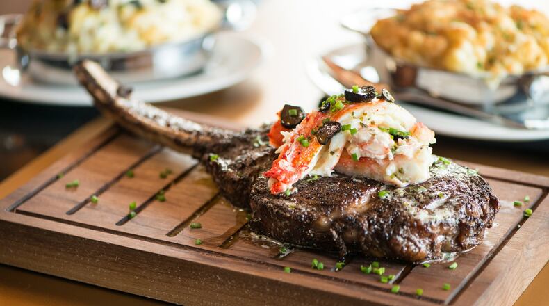 Del Frisco's Double Eagle Steakhouse Long- Bone Ribeye Wagyu Steak with crab. Photo credit- Mia Yakel.